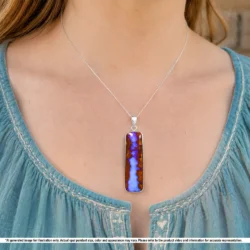 Natural Winton boulder opal pendant shown worn on a silver chain with blue purple opal and brown wood fossil matrix