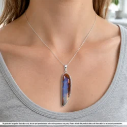 Natural Winton boulder opal pendant shown worn on a silver chain with purple opal and contrasting brown wood fossil matrix