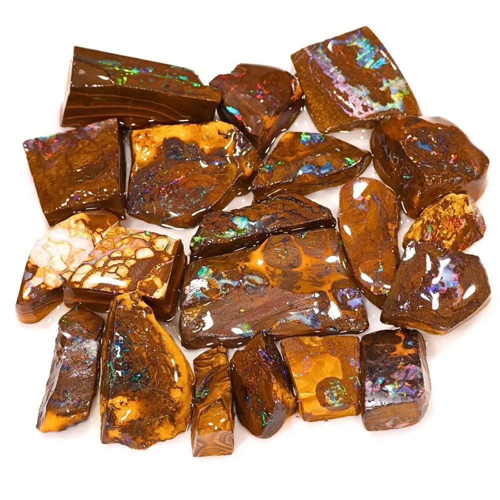 Close view of Rainbow Boulder Opal matrix rubs from Winton Australia showing green blue purple red and pink color in brown ironstone