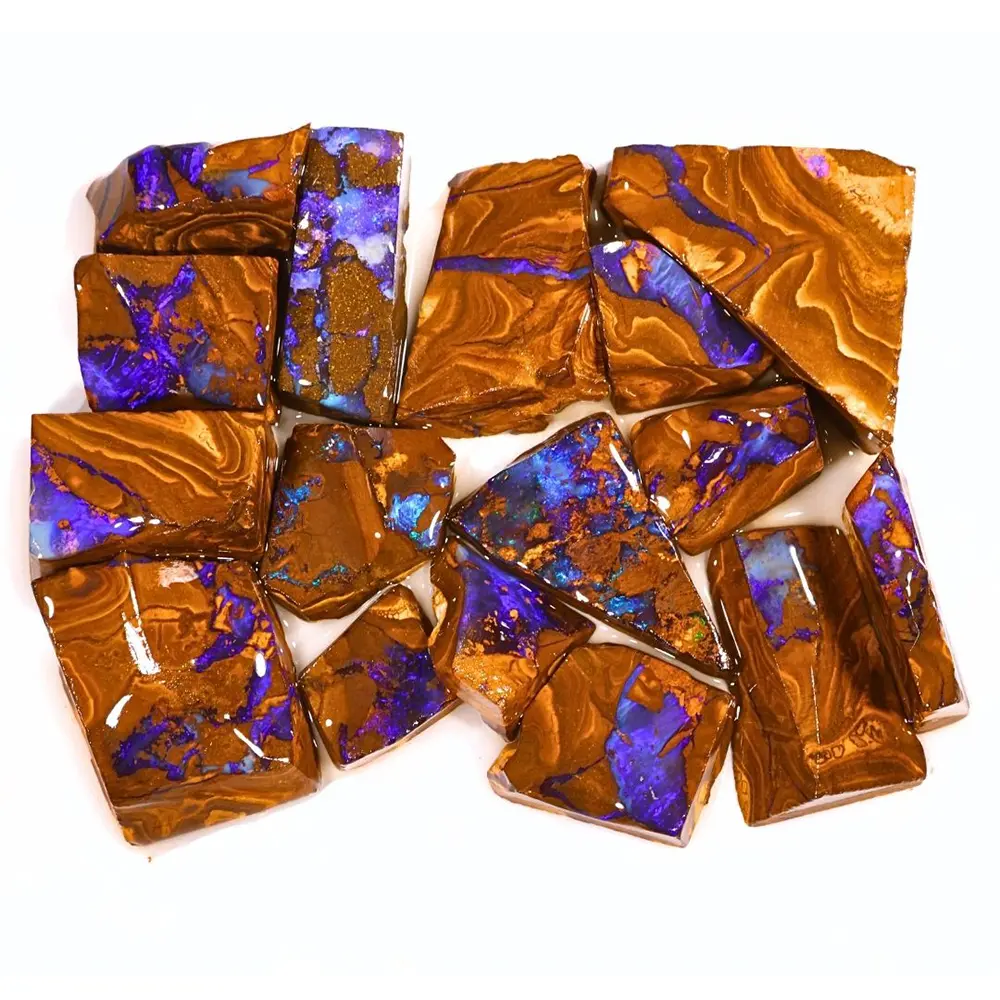 Close view of 16 natural Electric Purple Boulder Opal rubs from Winton Australia showing vivid purple and blue opal in brown ironstone matrix