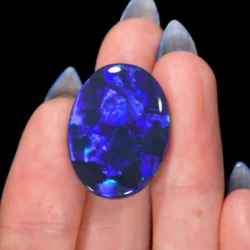 huge-black-opal-cabochon-on-hand-display-19-85ct-opal-galaxy