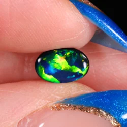 jet-black-opal-gemstone-finger-display-0-65ct-opal-galaxy
