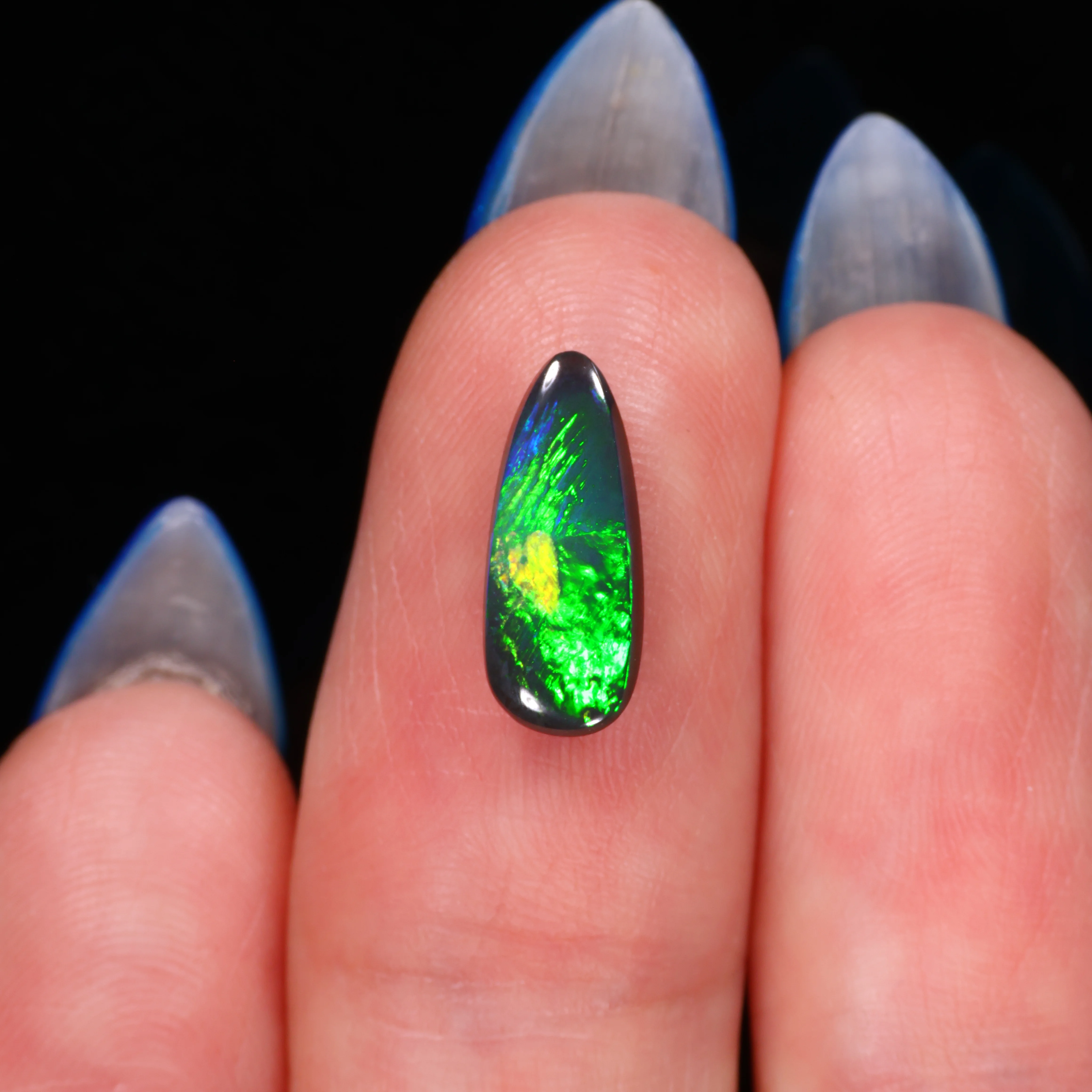 jet-black-opal-gemstone-finger-display-1-06ct-opal-galaxy