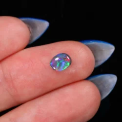 natural-australian-dark-opal-finger-display-0-55ct-opal-galaxy