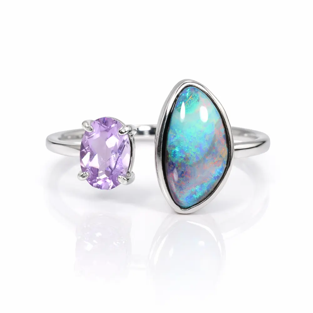 Australian boulder opal and lavender amethyst two gemstone adjustable ring displayed on white background with polished silver colored setting