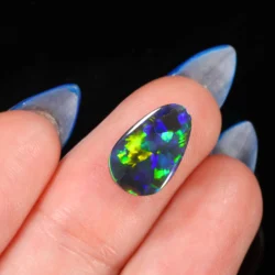 australian-black-opal-pear-finger-scale-on-hand-2-22ct-opal-galaxy