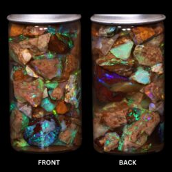 Gem quality pipe Crystal Boulder Opal chips showing green blue rainbow color and natural brown Queensland matrix under LED lighting