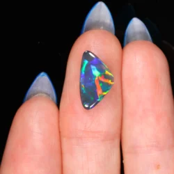 loose-australian-black-opal-on-hand-finger-scale-opal-galaxy