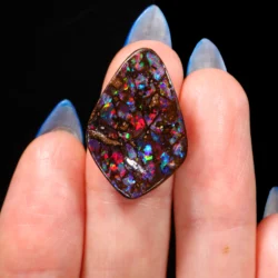 natural-church-window-boulder-opal-on-hand-scale-15-9ct-opal-galaxy