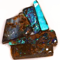 Natural Winton Boulder Opal rubs showing vivid blue and green play of color, purple flashes and intricate rainbow patterns across five partially worked gemstones.