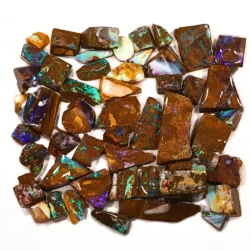 Full view of 50 Winton Boulder Opal rubs showing blue green purple and multicolor opal in natural brown ironstone matrix