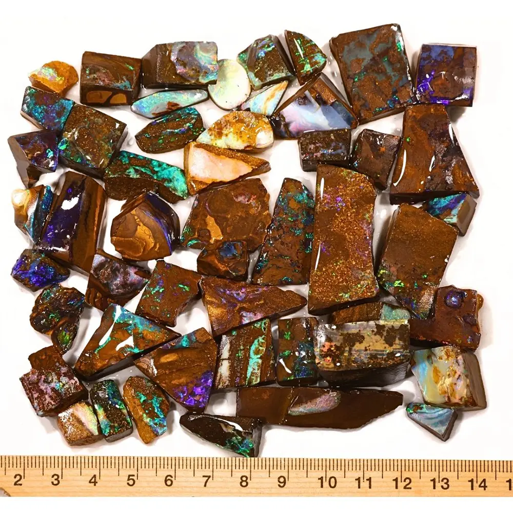 187g Winton Boulder Opal rubs parcel showing 50 natural Australian opal pieces with a ruler for size reference